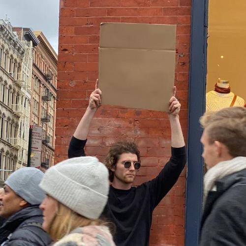 Guy Holding Cardboard Sign meme template